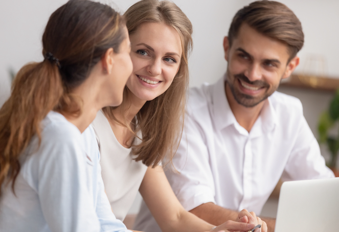 Parents smiling with daughter