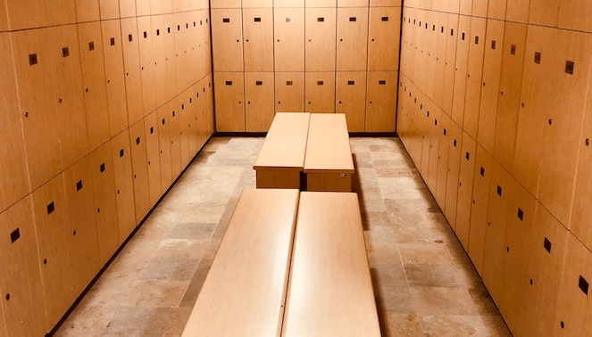 Empty gym locker room bathed in light