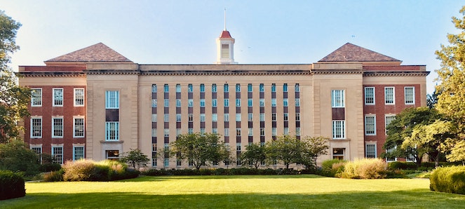 Front view of a college campus building on a sunny day